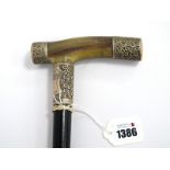 A Walking Cane with Straight Horn Handle, each end having a silver embossed collar, with large