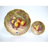 A Royal Worcester Porcelain Plate, painted by J. Reed, signed, with ripening fruit on a mossy