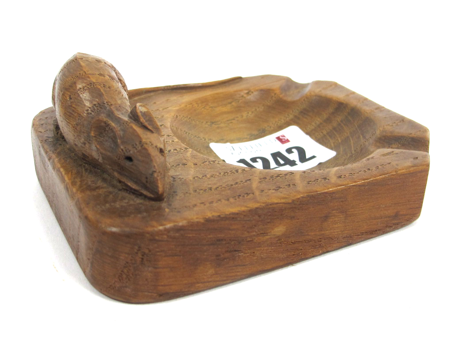 A Robert Thompson (Mouseman) Oak Ashtray, with carved mouse signature, 9.5cm long.