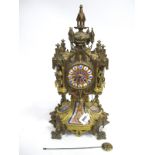 A Late XIX Century Ormolu Mantle Clock, with inset porcelain panels (one missing and one loose),