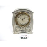 A Tudric Pewter Desk Clock, attributed to Archibald Knox for Liberty, relief decorated with stylised