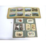 Two Albums of Early XX Century Picture Postcards, to include; Birthday and Christmas greetings,
