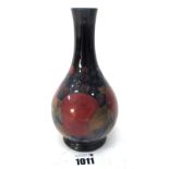 A Moorcroft Pottery Vase, of pear shape with elongated neck, painted in the Pomegranate pattern