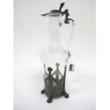 An Art Nouveau Style Glass Claret Jug, with pewter cover and base pierced with stylised motifs, 31cm