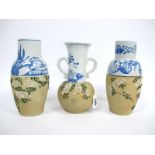 A Garniture of Three Early XX Century Japanese Pottery Vases, the upper sections painted in blue