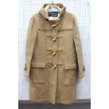 An Original Gloverall Duffel Coat, in beige with horn toggles and leather hooks, size 40.