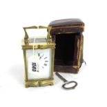 An Early XX Century Brass Cased Carriage Clock, with cream enamel face (cracked) with black Roman