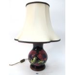 A Moorcroft Pottery Table Lamp, painted in the Anemone pattern with pink and purple flowers