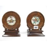 A Pair of Late XIX Century Chinese Hardwood Book Ends, each inset with circular porcelain panels