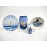 A Royal Copenhagen Porcelain Vase, of baluster form, painted with a sailing boat on a calm sea,