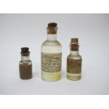 Three Interesting Late XIX Century Bottles of Clock Oil, J.D Windles No 21702, 8.1cm high, along