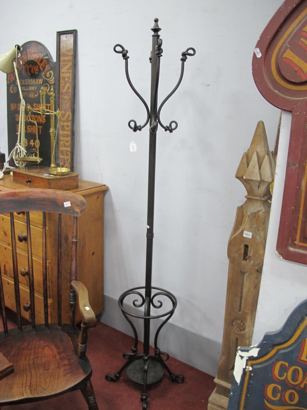 Cast Metal Coat Stick Stand, with a drip tray, scroll feet.