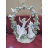 Lladro Figure Group of a Girl on a Swing with Onlooking Friend, Number F-160, 38cm high.