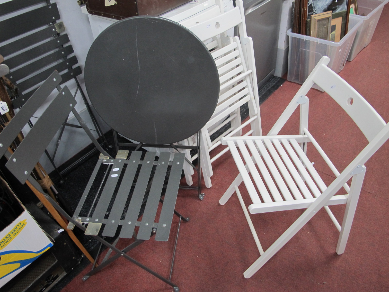 A Garden Patio Grey Folding Table and Two Chairs, with three white painted garden chairs.