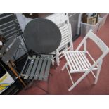 A Garden Patio Grey Folding Table and Two Chairs, with three white painted garden chairs.