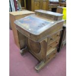 A XIX Century Davenport, upper section with a hinged lid, fitted interior, fall front, four drawers,