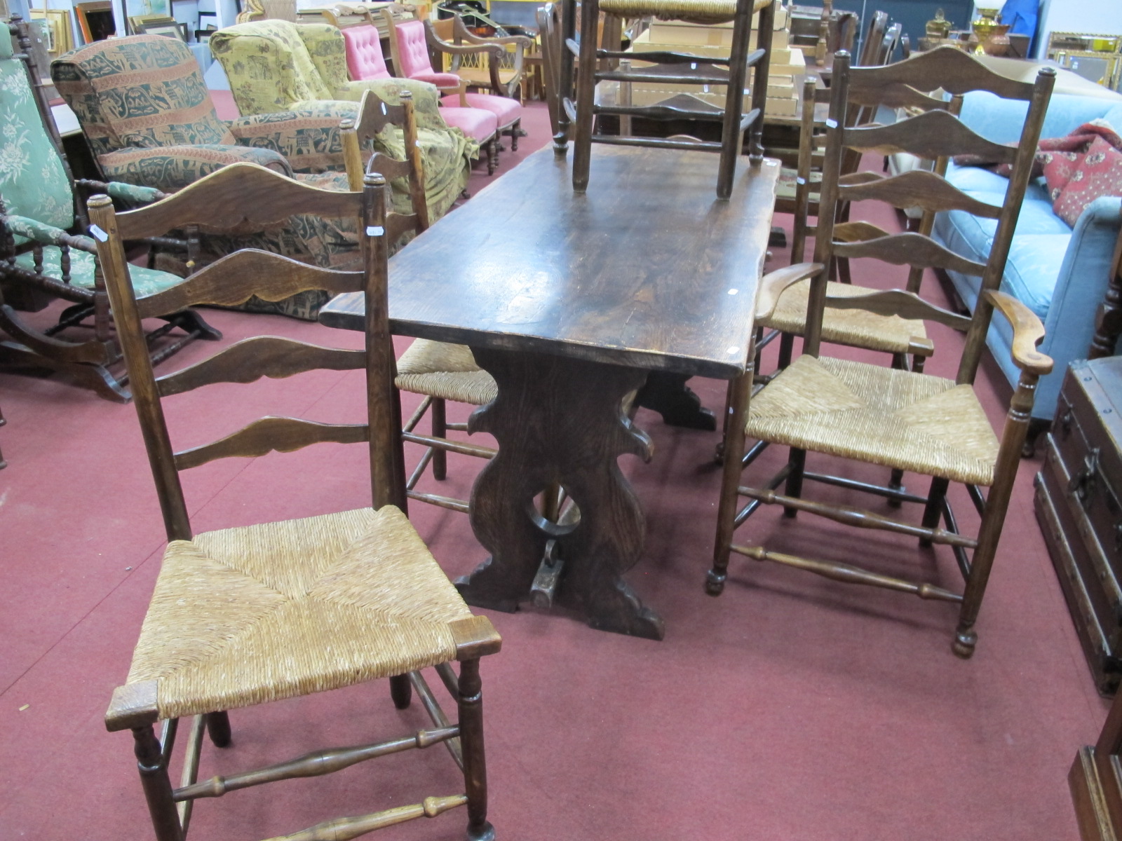 A XX Century Oak Refectory Table, with a rectangular top, trestle ends, centre rail, together with a