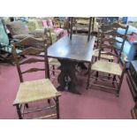 A XX Century Oak Refectory Table, with a rectangular top, trestle ends, centre rail, together with a