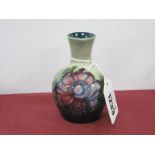 Moorcroft Pottery Bulbouse Vase, painted in the Anemone pattern with pink and maroon flowers, on