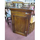 A XIX Century Mahogany Corner Cupboard, with a panelled door, three internal shelves.