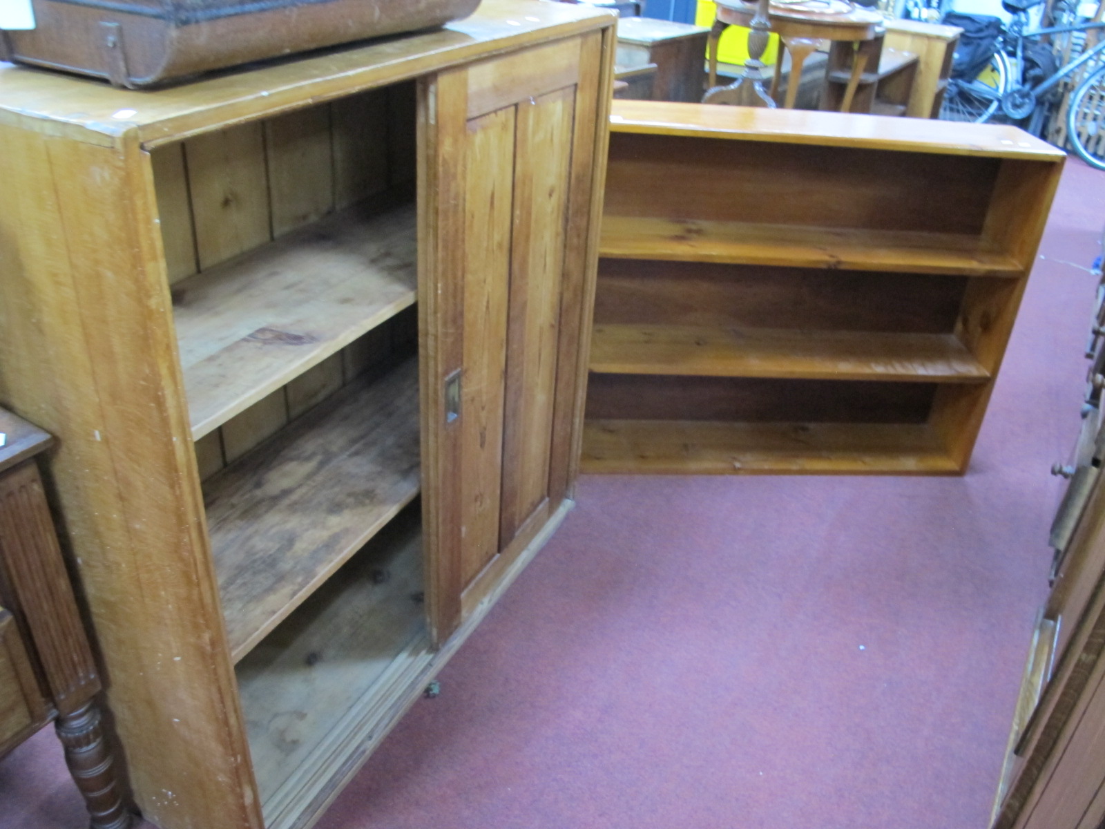 A XIX Century Pine Cupboard, with sliding cupboard doors, together with later pine bookshelves.