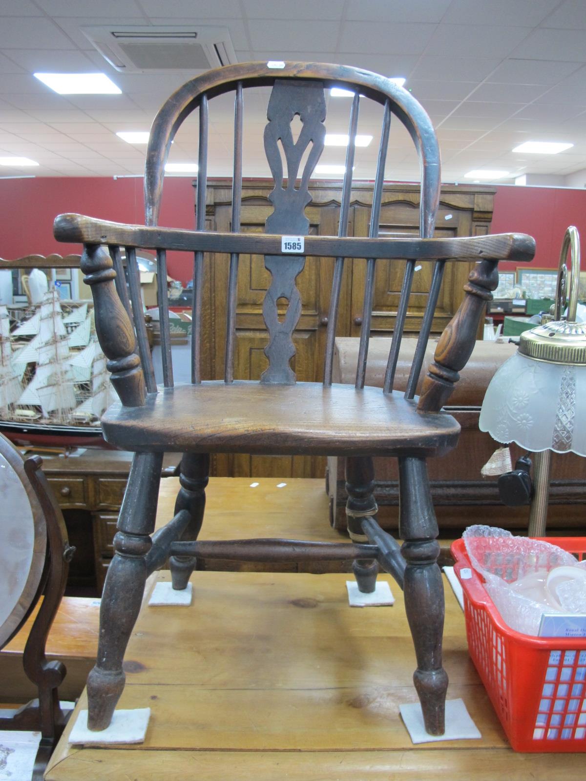 A XIX Century Ash-Elm Child's Windsor Chair, with a hooped back, pierced splat, on turned legs, with