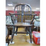 A XIX Century Ash-Elm Child's Windsor Chair, with a hooped back, pierced splat, on turned legs, with