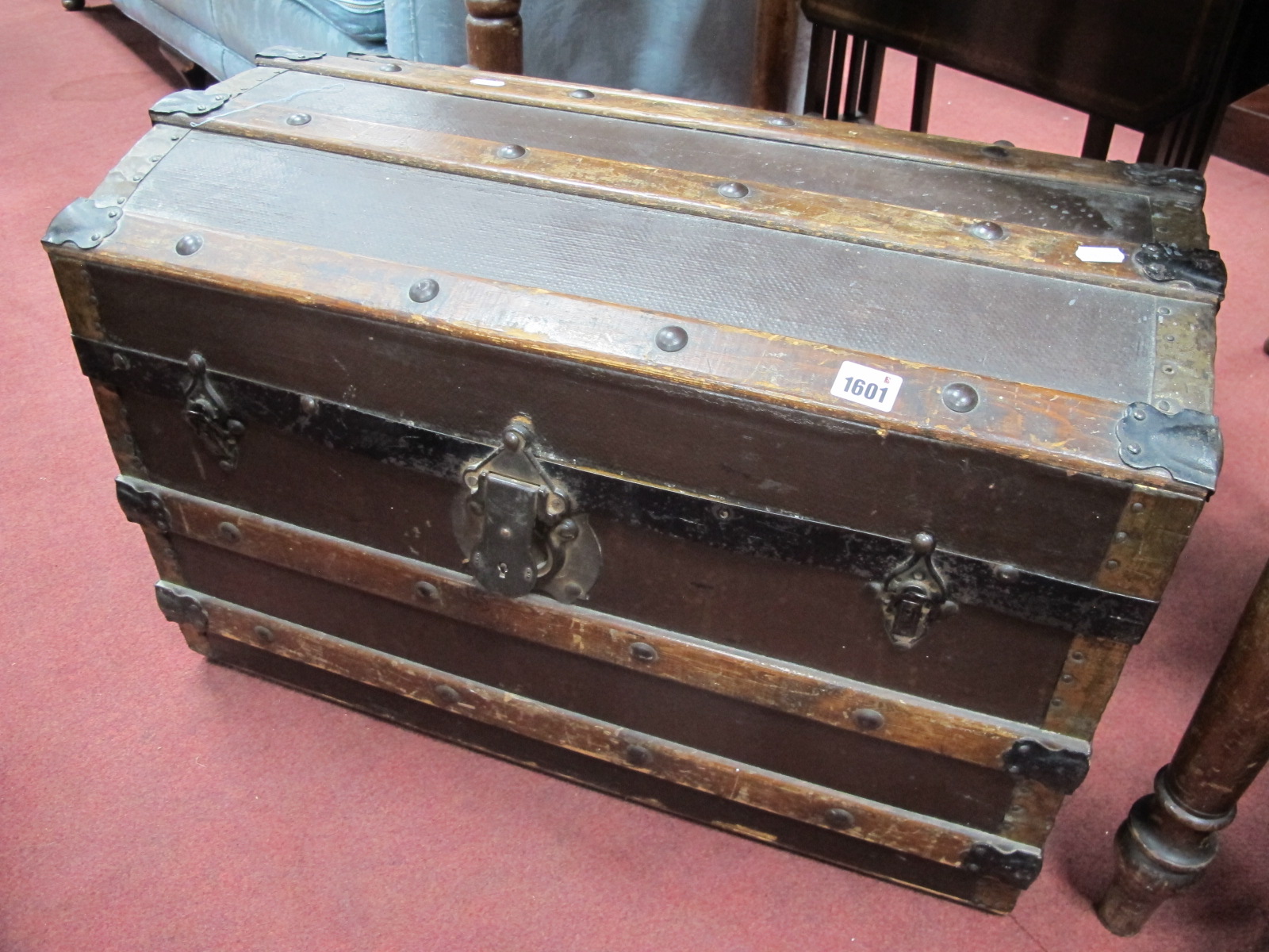 A Late XIX Century Domed Top Travelling Trunk, with wood slats, lock plate, twin handles.