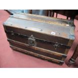 A Late XIX Century Domed Top Travelling Trunk, with wood slats, lock plate, twin handles.