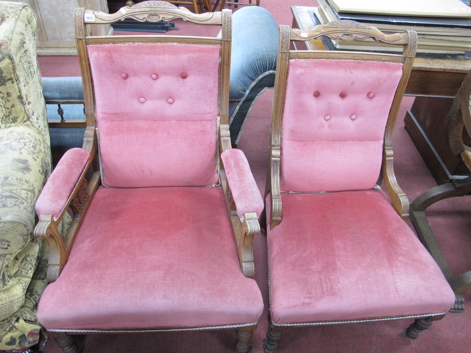 An Early XX Century Walnut His Hers Chairs, with a shaped top rail,upholstered back, seats, on