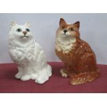 Beswick Pottery Seated Cats, in white and brown, 20cm high. (2).