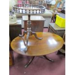 An Oval Shaped Mahogany Coffee Table, together with a Walnut wine table with a galleried top, on