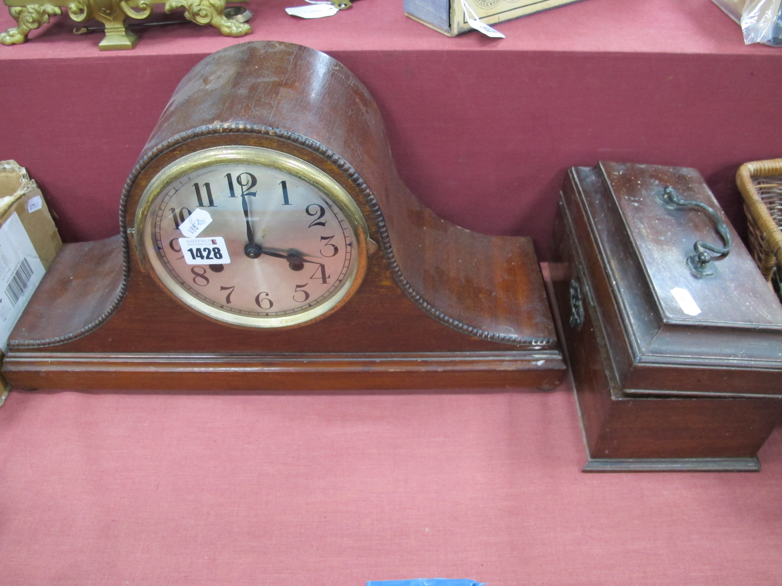 A XIX Century Mahogany Tea Caddy, (damaged) 24cm wide, dome topped mantle clock. (2).