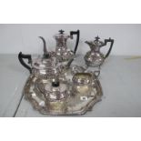 A Plated Four Piece Tea Set, of semi reeded form, together with a decorative plated tray and and a