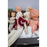 Four Toy Dolls, all clothed, plus a boy doll with detached parts, all playworn and displaying