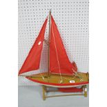 A Nauticalia (Shepperton-On-Thames) Wooden Model Pond Yacht, measuring approximately 56cm long, 60cm