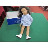 A Trendon Ltd Sasha Doll with Dark Hair, blue and white gingham dress, white vest, shorts, socks and