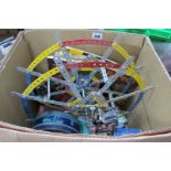 A Part Completed Mecanno Ferris Wheel, fitted with electric motor and gearing, plus a small quantity