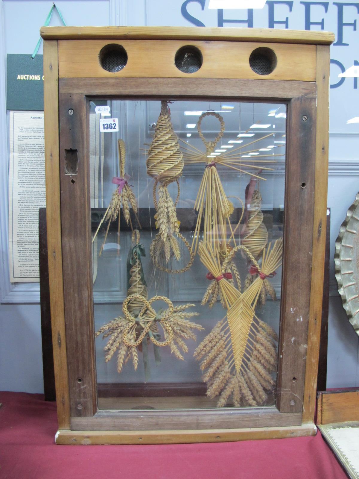 A Montage Display of Corn Dollies, (cased).