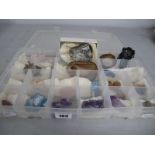 A Collection of Assorted Rocks / Crystals / Minerals, contained in a sectioned lidded box.