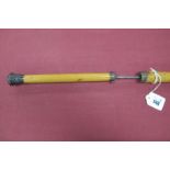 An Edwardain Malaca Walking Sword Stick, with push button release, white metal tip, brass ferrule,