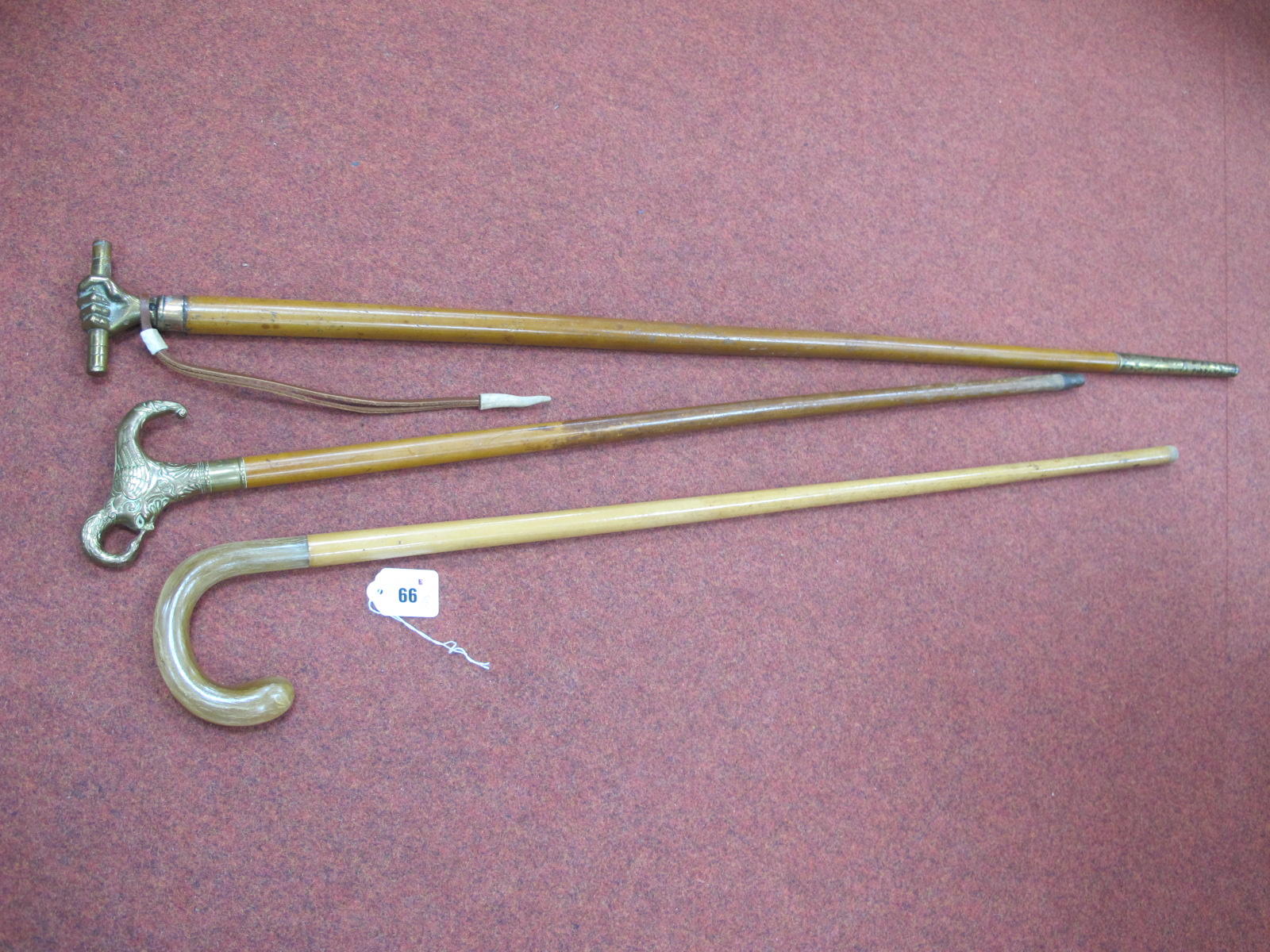 A Malaca Stick, with brass fist handle holding a baton, wrist hoop, copper ferrule, very long - Bild 2 aus 2