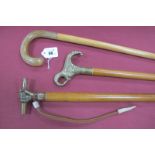 A Malaca Stick, with brass fist handle holding a baton, wrist hoop, copper ferrule, very long