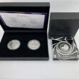 Royal Mint James Bond 007 Silver Proof Half Ounce Coin, together with a Westminster pair of Silver