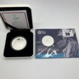 Royal Mint 2015 Silver Britannia £50 Coin, together with a East India Company 2020 Una and the