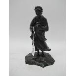 A Late XIX Century Japanese Bronze Figure of a Sage, in flowing robes, his hands clasped, upon a