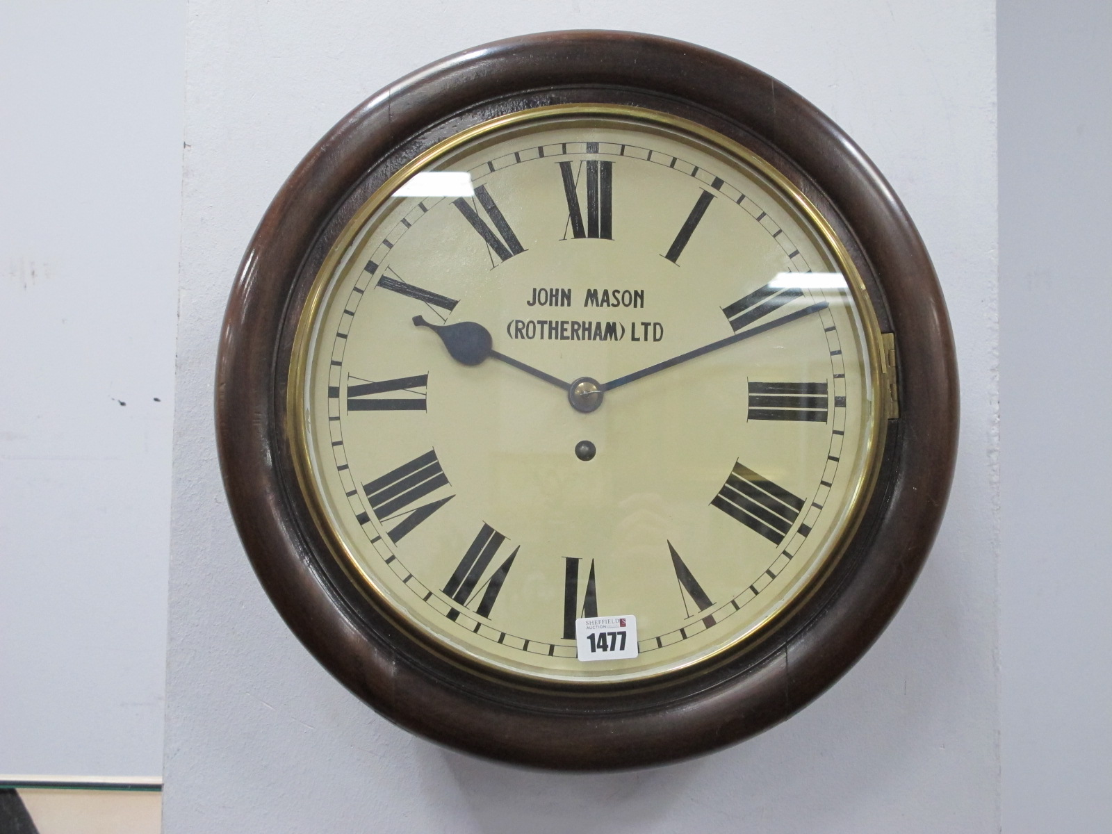 A Late XIX Century Circular Mahogany Wall Clock, the cream enamel dial inscribed "John Mason (