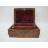 A XIX Century Mahogany Writing Slope, top with a brass shield insert, brass escutcheon, fitted