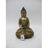 A Late XIX/Early XX Century Gilt Bronze Figure of a Buddha, seated in the lotus position with legs