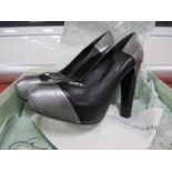 A Pair of Pierre Balmain 'Decolette' Black and Silver Leather Shoes, with platform sole and high